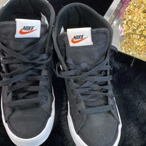 Black Nike high tops.